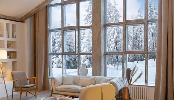 House Interior with Large Windows and Snowy View