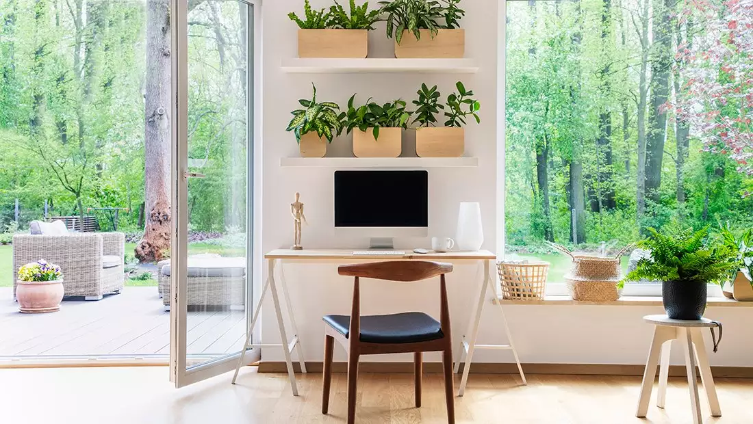 Small Home Office in Living Room Facing Large Patio Door and Windows with Outdoor Living View